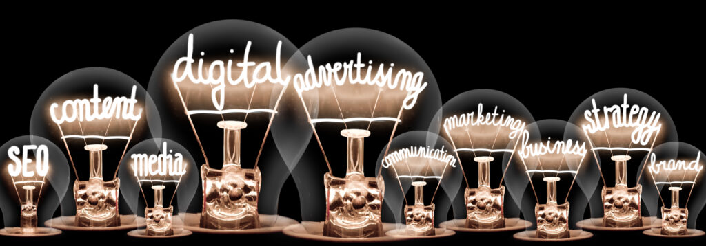 row of lightbulbs with various aspects of marketing written in the coils of each bulb