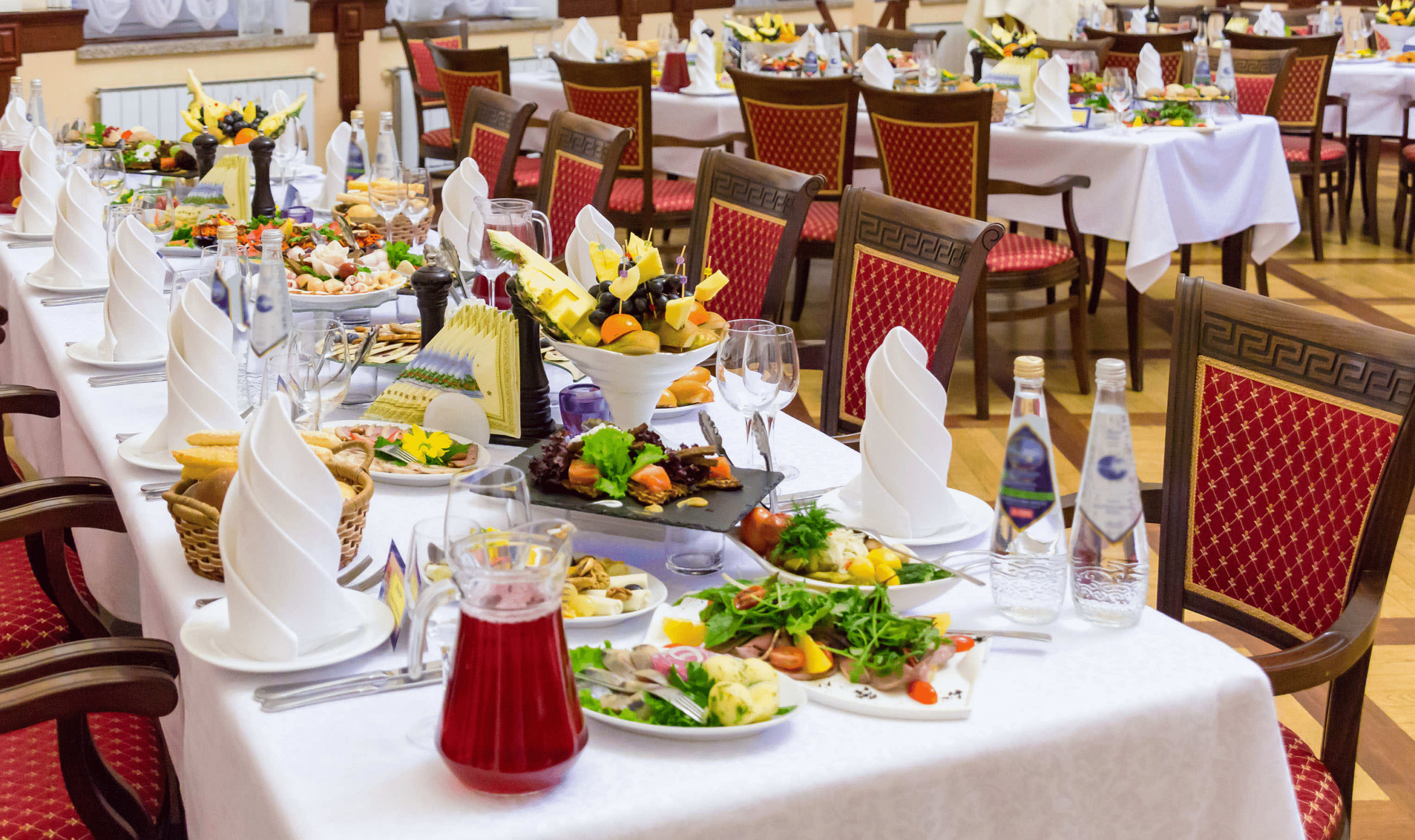 fancy dining room setup full of banquet food at an event